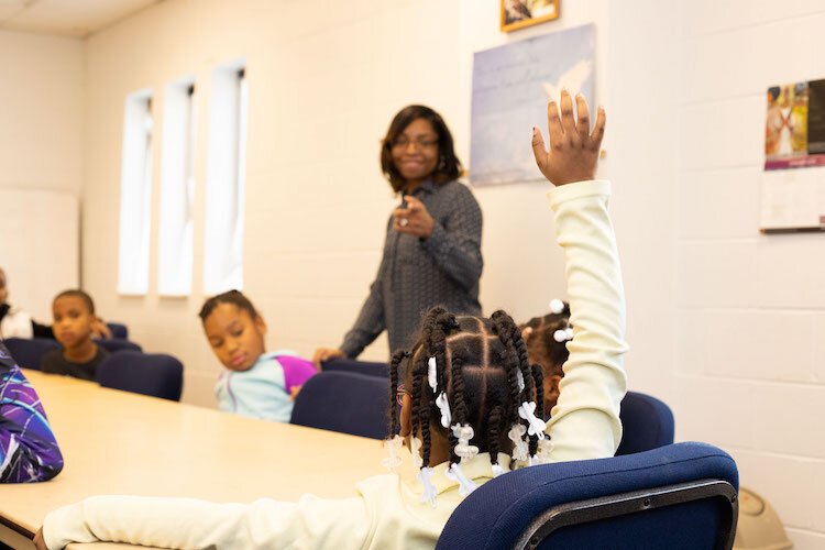 Dream League founder and CEO Gabrielle Davis works with students during a session. One goal of the program is to build confidence, especially with students who have never picked up an instrument before.