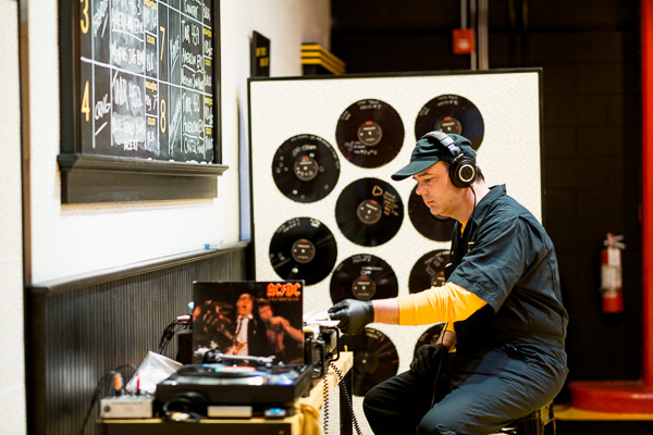 A Third Man worker selecting a record to play for the production floor