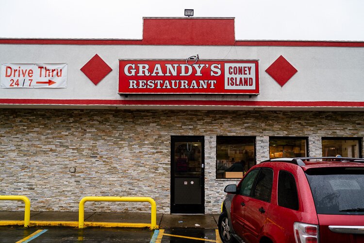 Amy Haimerl starts her day with a hearty meal of eggs, cheese, and bacon at Grandy's Restaurant on the east side.