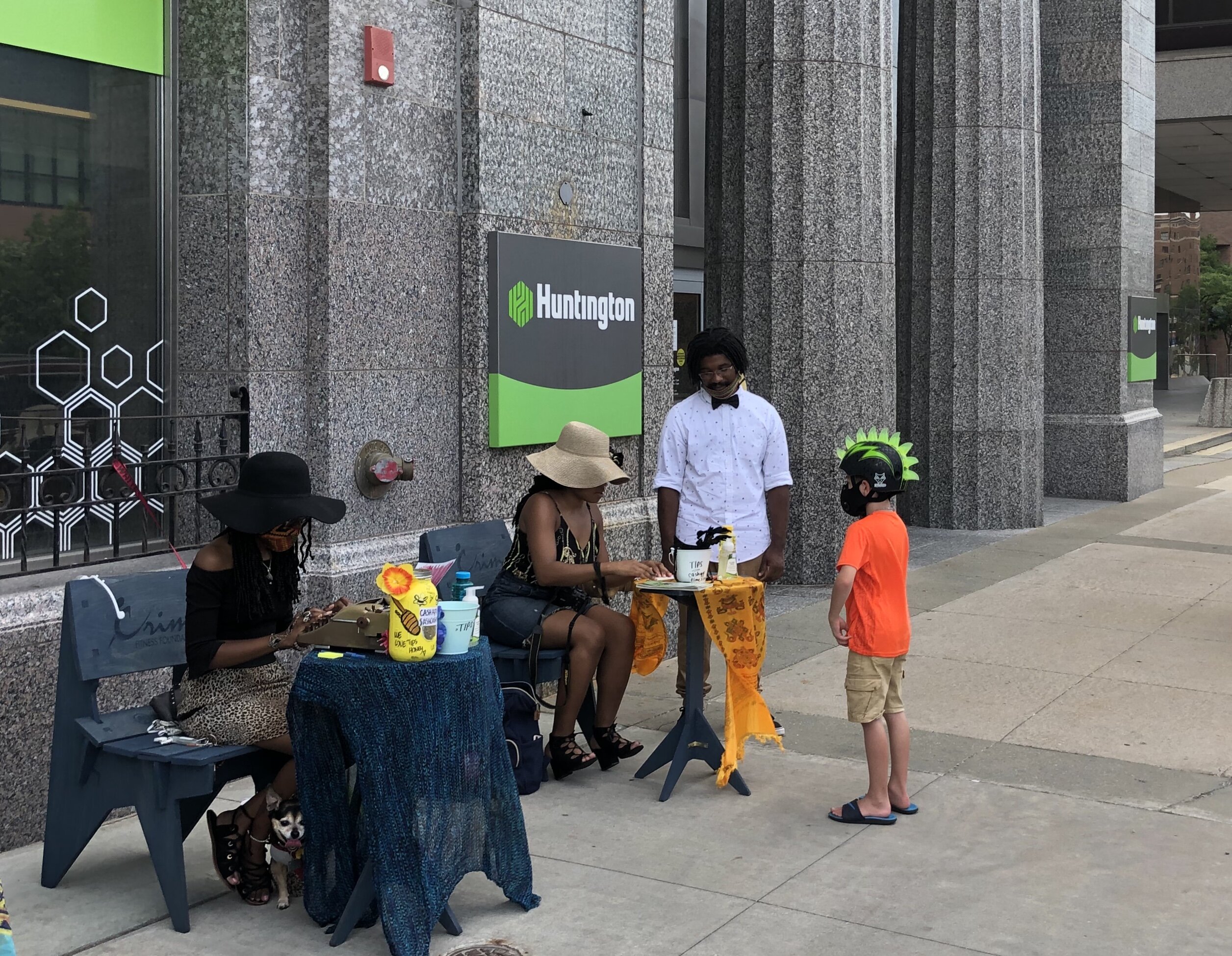 Shiann Howard creates a poem for a young Art Walk attendee.