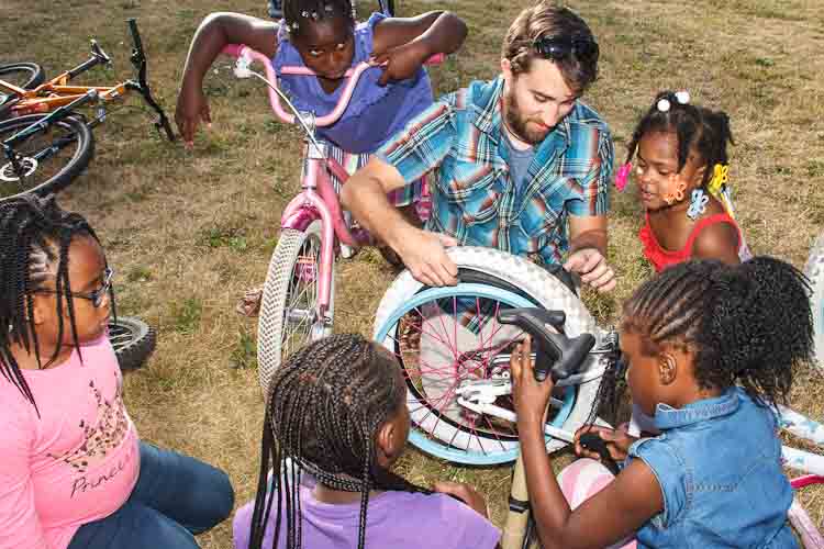 Dave Brown of Open Roads helps with tires