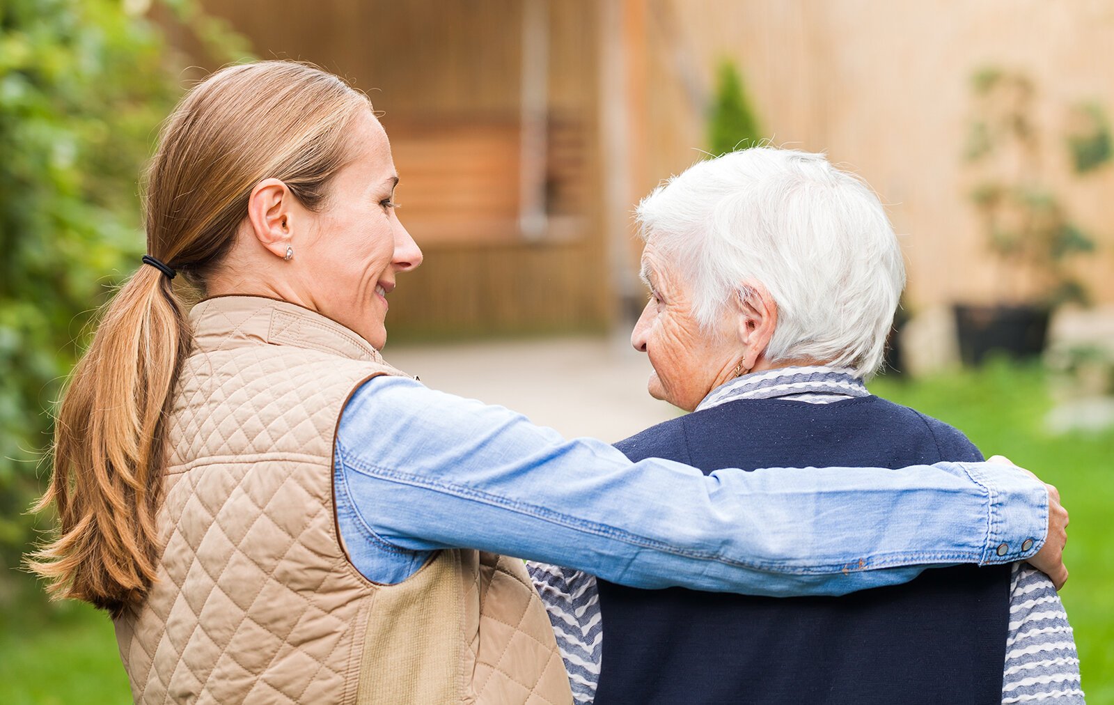 Woman walks with an older woman