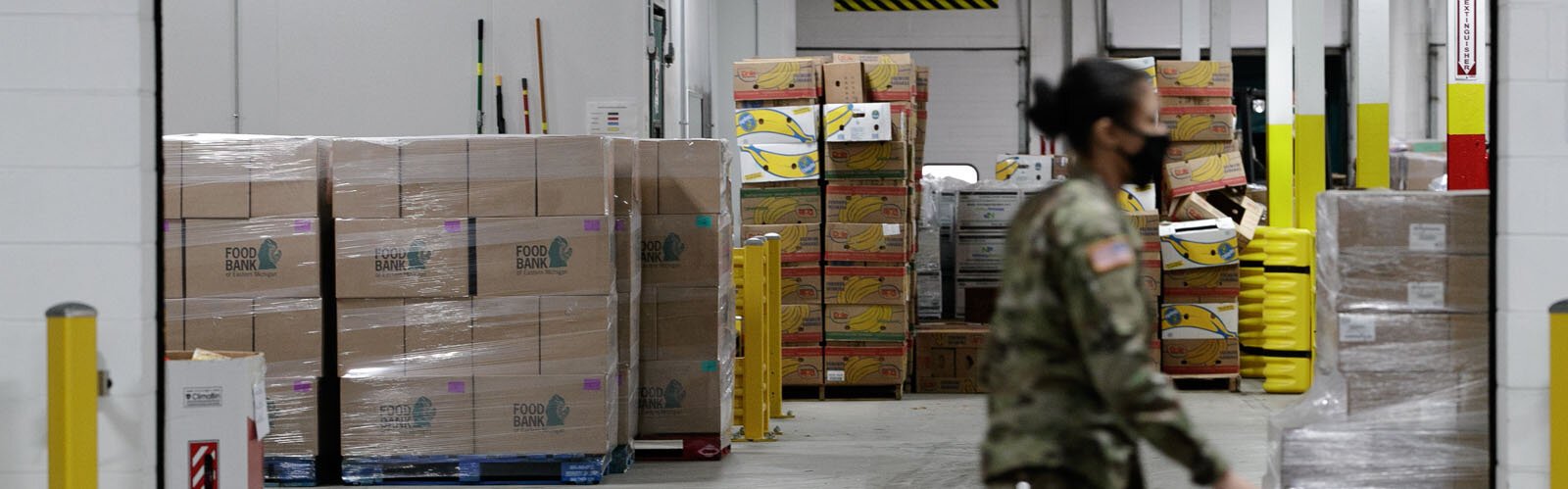 An Air Force Reserve member works in the Food Bank of Eastern Michigan warehouse.