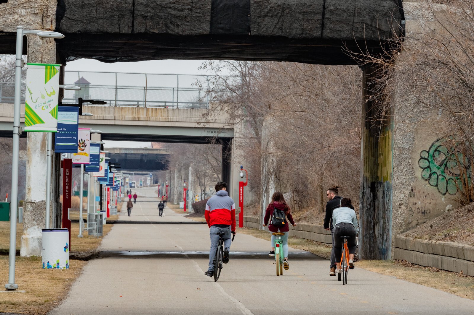People biking along the Dequindre Cut in Detroit.