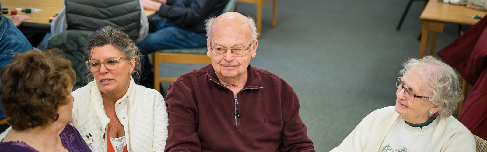 Seniors play poker at Sanford Activity and Dining Center in Midland.