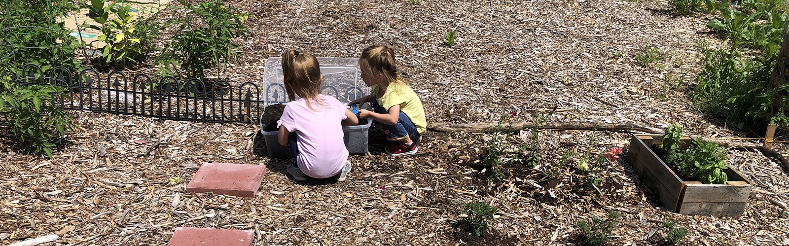 Children in the Child and Family Charities Family Growth Center's community garden.