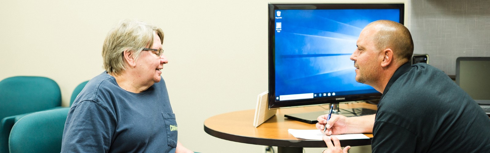 Lee Township resident Judy Wirtz confers with community health worker Jerry Burton.