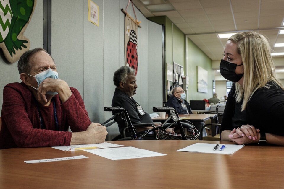 Becca Lindgren, a social worker, talks with a LifeCircles PACE participant. LifeCircles provides primary care and physical, speech, and occupational therapies to all participants.