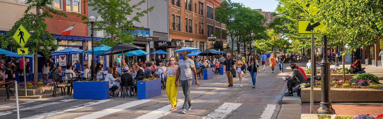 People walk down Main Street in Ann Arbor.