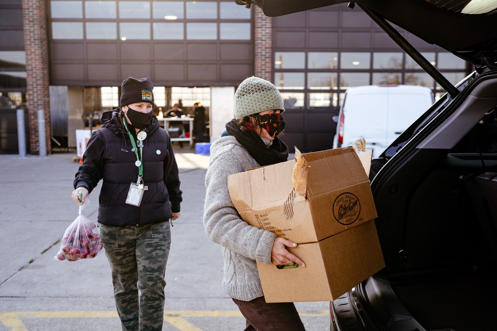 Eastern Market staff load food boxes that were ordered online.