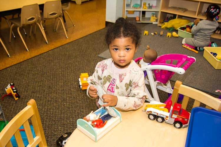 A child plays at the Kalamazoo Drop-In Child Care Center.