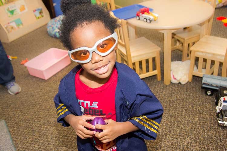 A child plays at the Kalamazoo Drop-In Child Care Center.