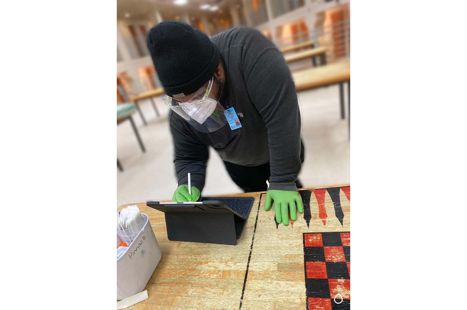 Antonio Cleveland, a disease intervention specialist with the Jail Health division of Wayne County’s Department of Health, Human, and Veterans Services, conducts COVID-19 contact tracing and testing for an individual booked into a Wayne County Jail.