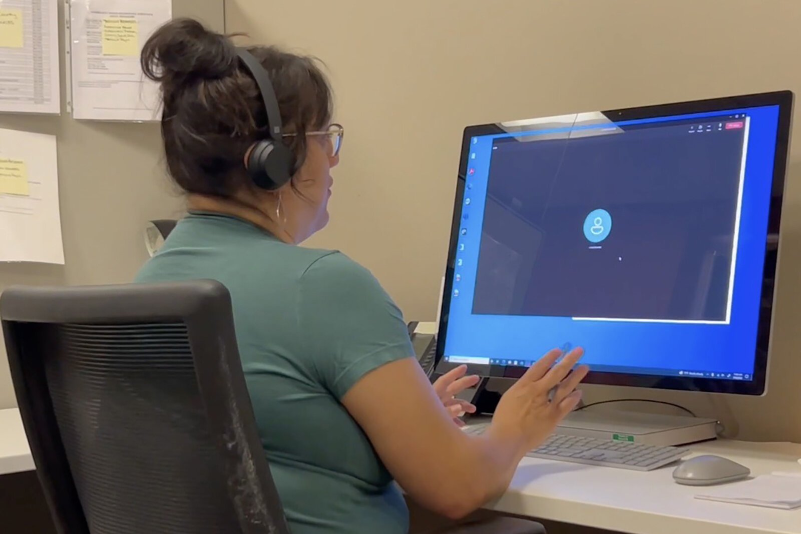 An operator in the call center at Network 180, Kent County's community mental health agency.