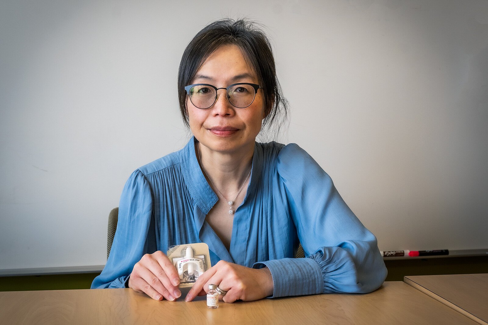 Michigan OPEN partnering provider Dr. Chin Hwa (Gina) Dahlem holds naloxone nasal spray.