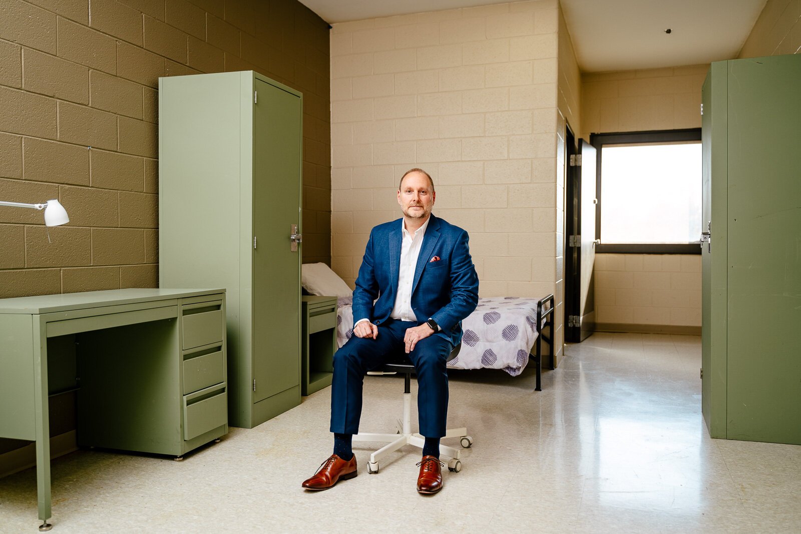 Jamie Winkler, executive director of the Salvation Army Great Lakes Harbor Light System, in a short term residential care room at the Salvation Army's Harbor Light facility in Detroit.