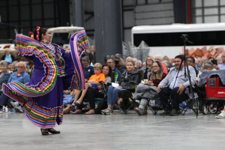 Ballet Folklórico Sol Azteca member Angela Gonzalez-Urbina dances to the song “El Jarabe Tapatio”, being performed by Mariachi Garibaldi de Jaime Cuéllar of Los Angeles, California, during the Holland Symphony Orchestra’s “Mariachi & the Movies” comm