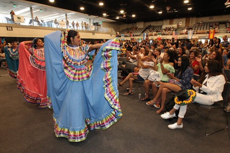 Members of the dance group Ballet Folklórico Sol Azteca receive an ovation while performing at the LAUP ¡Fiesta! in the Holland Civic Center July 9.
