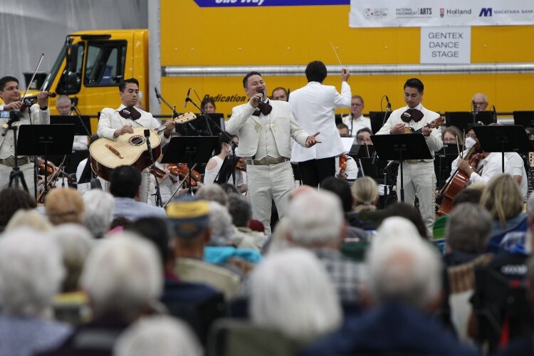 Gustavo Hernandez and Mariachi Garibaldi de Jaime Cuéllar, of Los Angeles, California, perform at the Holland Symphony Orchestra’s “Mariachi & the Movies” community concert at M.E. Yacht Restoration in Holland Township, August 13.