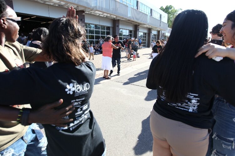 Salsa dance group Salserines teach visitors to salsa dance outside of the Holland Civic Center during the LAUP ¡Fiesta! July 9.