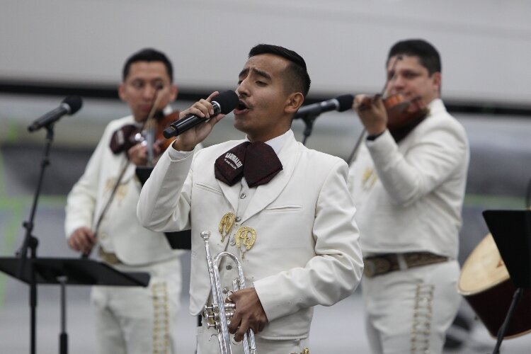 Grover Castro and Mariachi Garibaldi de Jaime Cuéllar, of Los Angeles, California, perform at the Holland Symphony Orchestra’s “Mariachi & the Movies” community concert at M.E. Yacht Restoration in Holland Township, August 13.