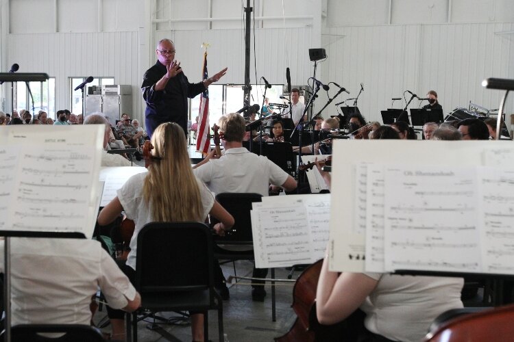 Byron Stripling conducts the Holland Symphony Orchestra during their "Pops at the Pier" concert at Eldean Shipyard in Macatawa, Michigan, June 16, 2022.