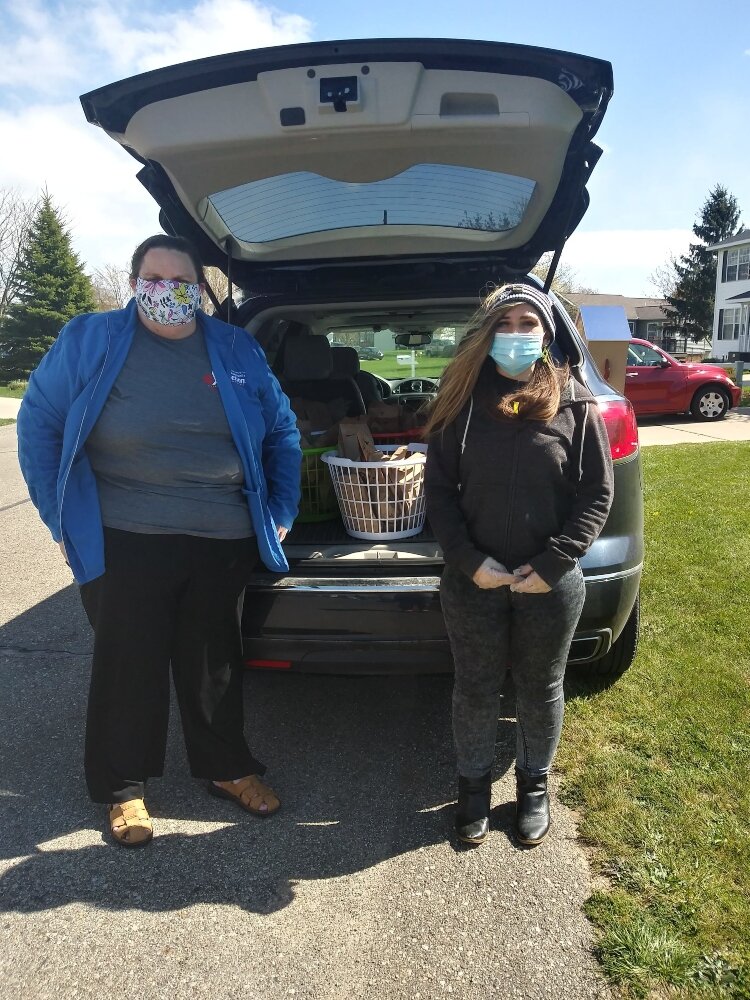 Autumn Fitchett and Brenda Molendyk deliver food.