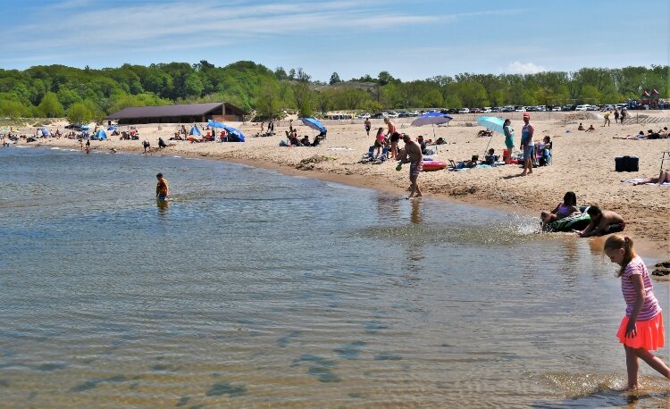 Pandemic restrictions limited Memorial Day attendance at Holland State Park.