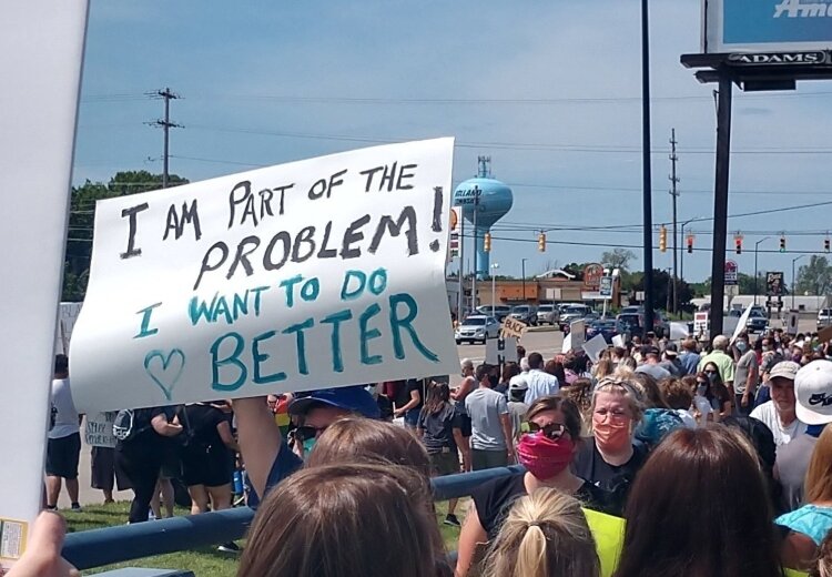 A protester carried this sign during the George’s Peaceful Unity Demonstration in Holland on June 7.