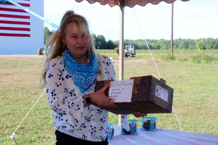 Shelly Hartman of True Blue Farms in Grand Junction explains economic impacts of foreign blueberries flooding U.S. markets during peak harvest season during a farm visit with Secretary of Agriculture, Sonny Perdue. 