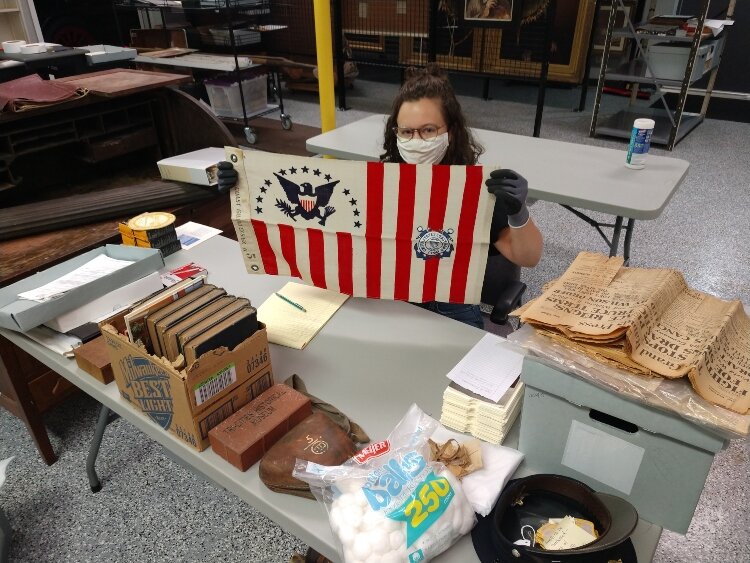 Margaret Paxton, Assistant to the Curator of Collections, working at the Community Archives and Research Center.