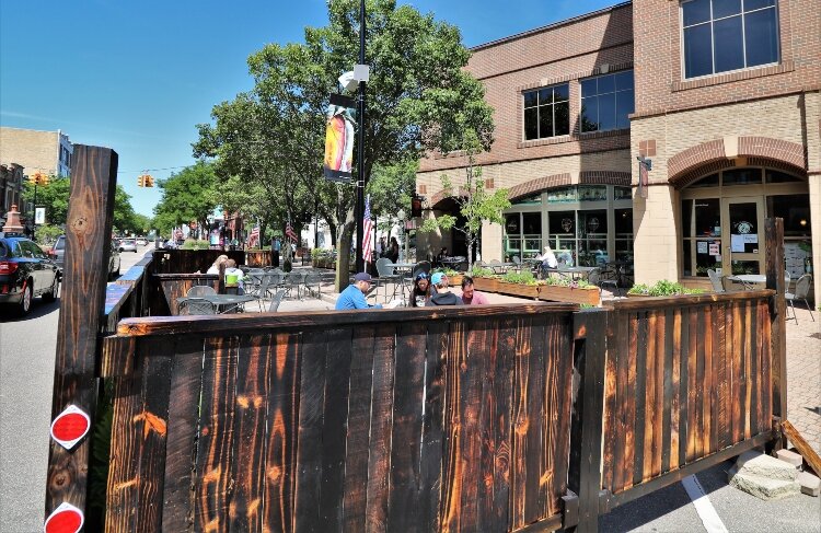 A dozen volunteers built a patio fence for the Curragh Irish Pub.