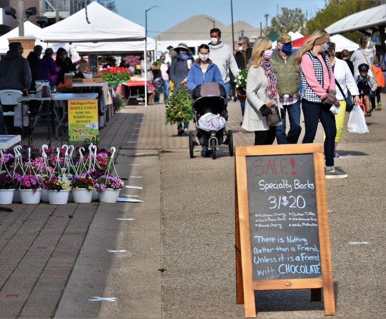 Restrictions discouraged the customary meeting and greeting at the market.