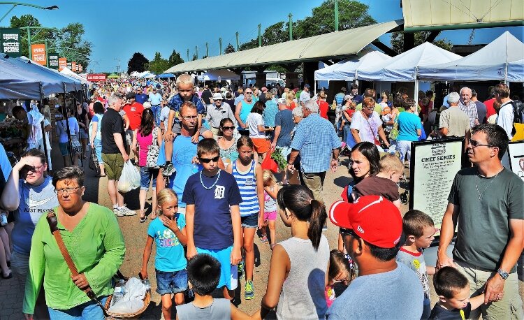 A crowd like this one during a typical market season could not be accommodated under current restrictions.