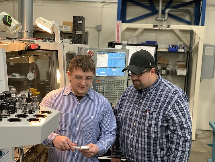 James Golden talks with his supervisor, Dustin Bruse.