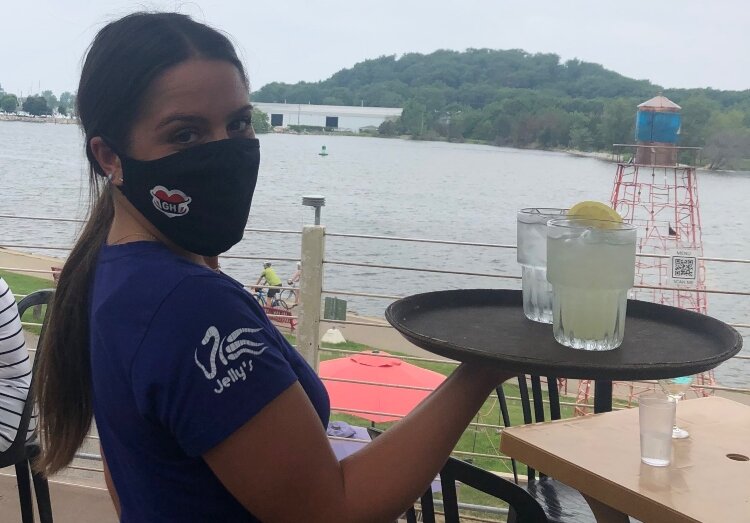 Restaurant workers are taking part in campaign encouraging everyone to wear masks.