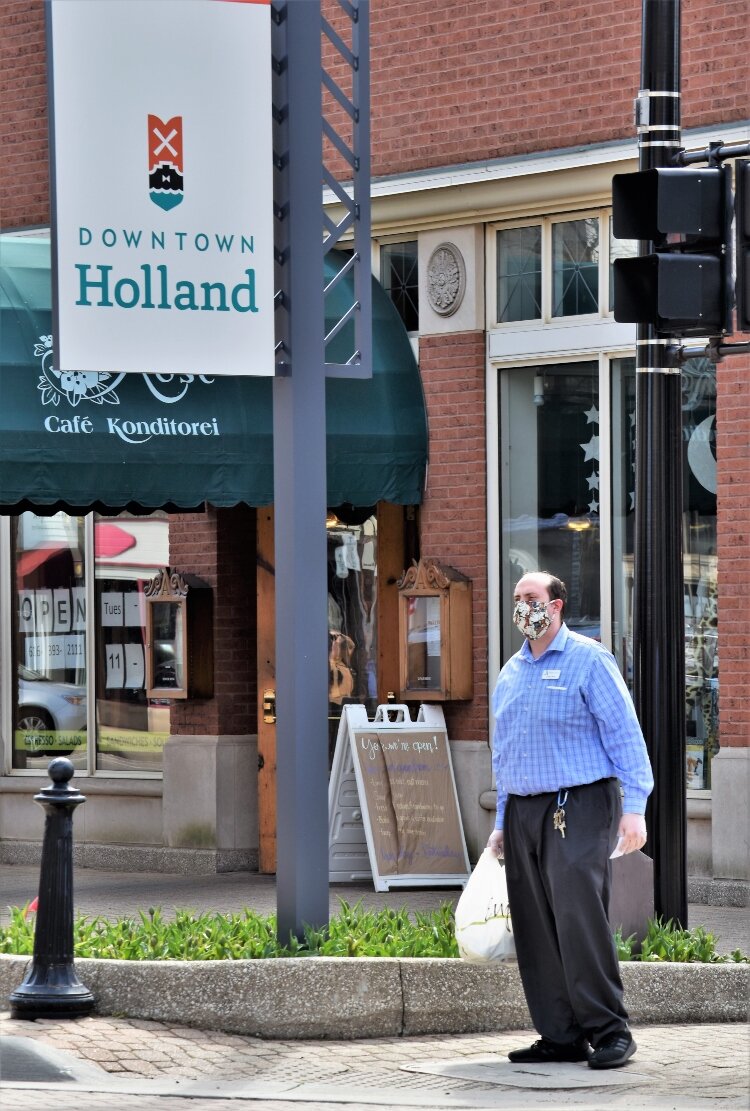 Visitors to downtown Holland on a sunny Saturday were few and far between, and most wore protective masks.