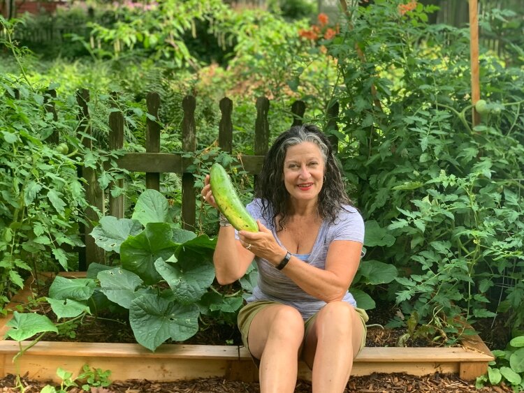 Michelle Bombe in her garden at her Laketown Township home.