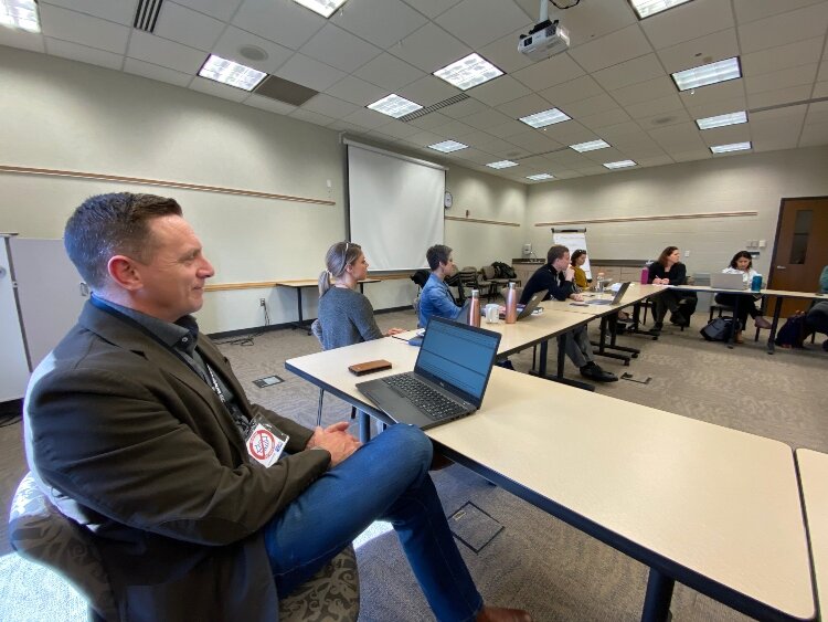 Ottawa County United Way President Patrick Moran meets with other nonprofit leaders to discuss how to meet community needs.