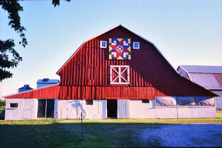 The Pigeon River Quilt Trail features beautiful quilt patterns adorning barns and outbuildings, family homesteads, and public spaces.