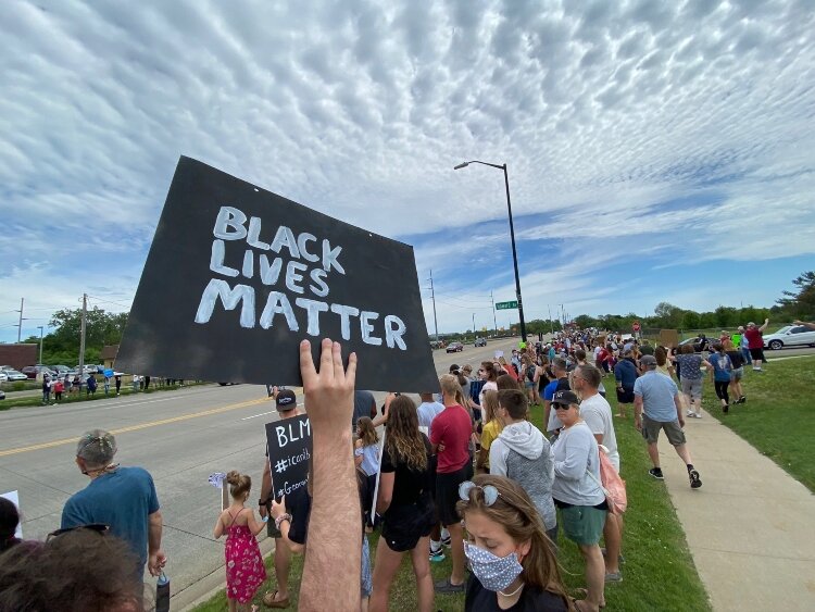 More than 3,000 people lined Unity Bridge on June 7 to show their solidarity in standing against racism in America.