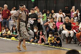 Prettyrock Big Bear, of the Pokagon Band of Potawatomi from Dowagiac, performs a jingle dress exhibition dance for spectators attending the International Festival of Holland at the Holland Civic Center. (J.R. Valderas)