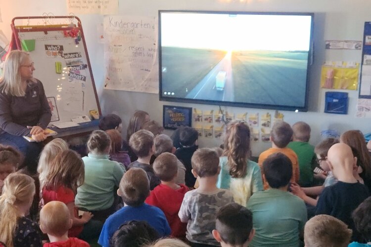 Shirley Monte, Key Account Manager with Dairy Amcor, gives a presentation on the agricultural industry to elementary school students. (WMW)