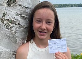 Ava Devanney with her COVID-19 vaccination card.