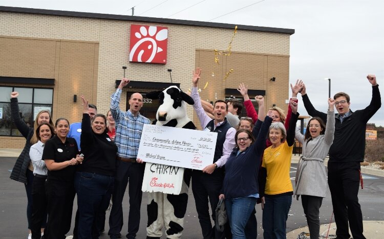  CAH Team and Holland Chick-fil-A Team celebrate the donation.