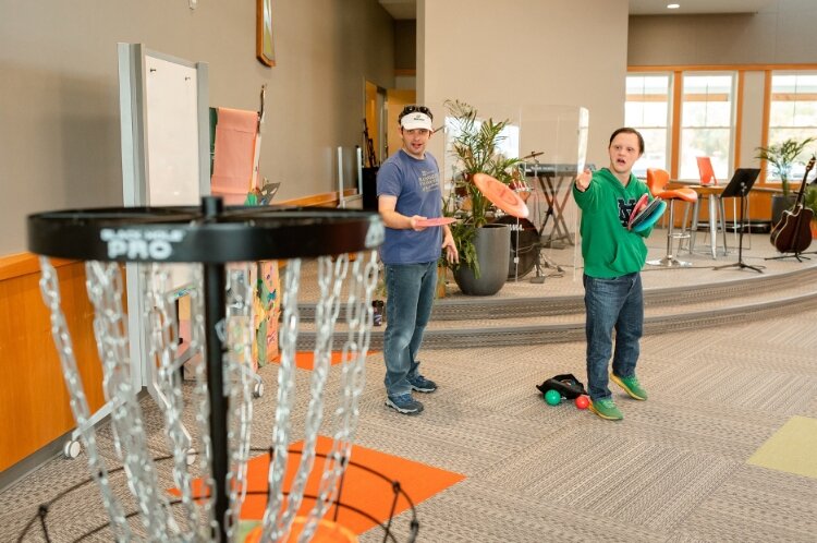 A Benjamin's Hope resident and his mentor play frisbee golf.