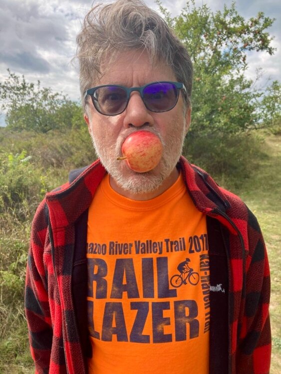 Mark Wedel, still a bit uncivilized after his long solo bike journey, trying the fruit of one of the many wild-growing apple trees. It's said that Mormons brought apple trees to the island in the 1850s.