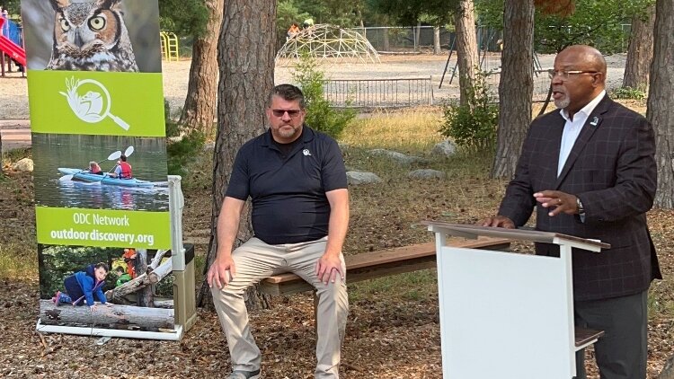 Rawlan Lillard II, deputy director at MiLEAP, speaks at ODC’s “Best of Summer” celebration as Bob Wandel, ODC education director, looks on.