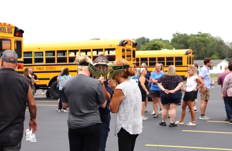 The safety training included drivers practicing with protective respirators.