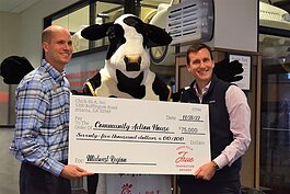 Shaun Page (left), Chick-fil-A Operator, presenting a check to Action House CEO Scott Rumpsa (right)